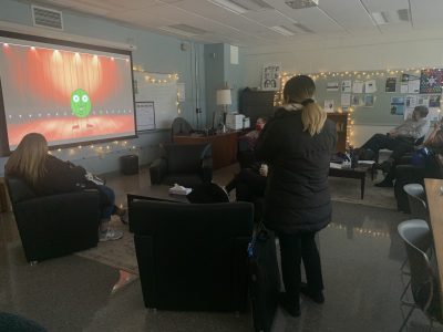 A photo of students and faculty watching student made animations.