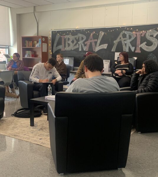 Students listening to alum speaker