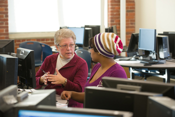 Linda Murphy instructs an NECC student in the Riverwalk computer math lab