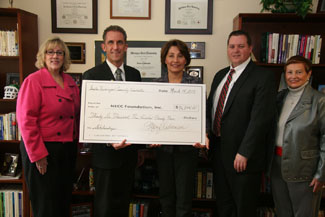 Newburyport Chamber Director Ann Ormond, NECC President Lane Glenn, Chair of the Greater Newburyport Community Center Foundation Mary Williamson, and Scott Eaton, chairman of the Newburyport Chamber Board of Directors.