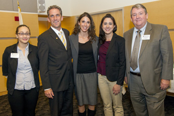 NECC student trustee Emily Ramirez, NECC President Lane Glenn, NECC alumna Lindsey Curole, and William Moynihan, Chairman of the NECC Board of Trustees.