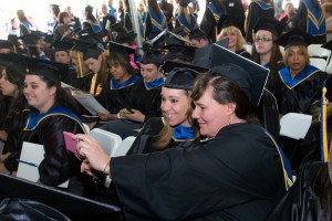 NECC graduates took selfies during the 52nd commencement ceremony.