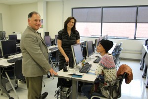 Mike Hearn, director of library services, Jenny Fielding, coordinator of library services, Lawrence, and NECC education major Jaritza Hildalgo of Lawrence in the college's new information literacy lab.