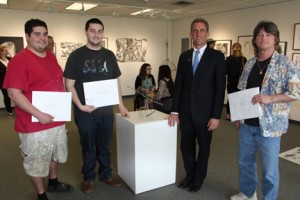 2015 NECC Student Art Show Winners (L to R) third prize winner Julian Cruz, President's Purchase Prize winner Ryan Silva, NECC President Lane Glenn, and Honorable Mention winner Frank Hawkes.