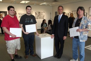 2015 NECC Student Art Show Winners (L to R) third prize winner Julian Cruz, President's Purchase Prize winner Ryan Silva, NECC President Lane Glenn, and Honorable Mention winner Frank Hawkes. 