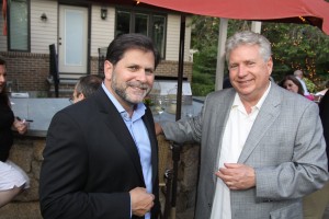 Glenn Prezzano, publisher of Merrimack Valley Magazine, (L) and Larry McHugh, who hosted the Women of NECC June event along with his wife Linda, chat during the event.