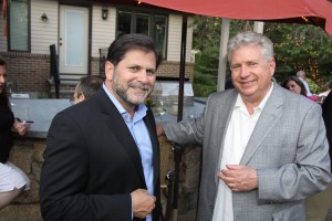 Glenn Prezzano, publisher of Merrimack Valley Magazine, (L) and Larry McHugh, who hosted the Women of NECC June event along with his wife Linda, chat during the event. 