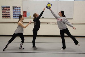 NECC dance students Katie Formosi of Groveland, Marissa Gagnon of Salem, NH, and Alyssa Foden of Methuen prepare their student choreographed pience "Moments" based n the children's book "The Kissing Hand".