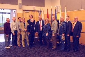 Shown left to right: NECC faculty, staff and student veterans: Al Hitchcock, staff,; Dave McCaskill, staff; Bill Zannini, faculty; Rich Sommers, staff; Jeff Linehan, chair of the NECC Board of Trustees, Dan Tirone, staff; Lawrence Mayor Dan Rivera; Shar Wolf, staff, Samson Racioppi, student; John Washington, student, John Caswell, student, and Bill Cox of the board of trustees.