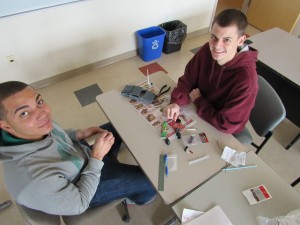 Northern Essex Community College students Jeffrey Cuesta of Haverhill, CAD certificate, and Andrew Sheehan of Methuen, engineering science, work on the DeLorean they designed and built using NECC’s 3D printer.