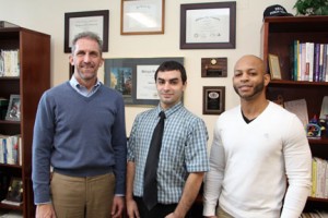 NECC President Lane Glenn with fourth quarter employee recognition award recipients Jason DeCosta and Victor DeJesus.