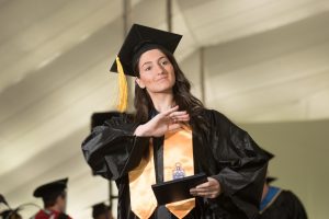 NECC graduate Taylor Langlois waves to family after receiving her dipoma. 