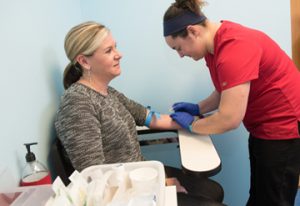 Clinical research coordinators are trained to take blood samples from clients.