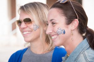 Staff members sport NECC temporary face tattoos