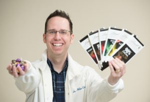 NECC Professor Mike Cross with chocolate he uses in his presentations.