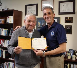 Ted Gaiero receives his degree from NECC President Lane Glenn. 