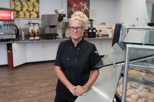 Felecia White stands at the counter in Newbury Cafe .