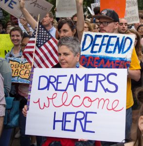 Photo of DACA demonstrators holding signs.