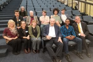 Larry Summers, president emeritus of Haverhill, posted on the chairs in lecture hall A with NECC faculty, staff, and students. 