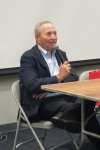 Larry Summers speaking into a microphone.