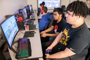 NECC student members of the Esports Team playing computer games.