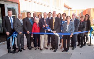 President Lane Glenn and retired president John Dimitry cut the ribbon to the renovated Dimitry building.