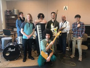 Photo of members of the NECC Jazz ensemble with instruments