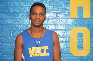 Abdoulfatah Abdillahi smiles while wearing his cross country jersey