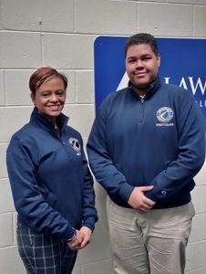 VP Noemi Custodia Lora and Joeph Trinidad both wearing Lawrence Alliance in Education sweaters.