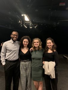 theater students standing on a stage