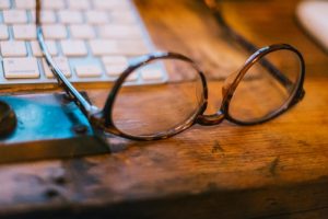 photo of laptop and glasses