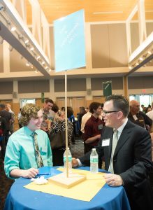 Student and employer speak during 2017 networking night 