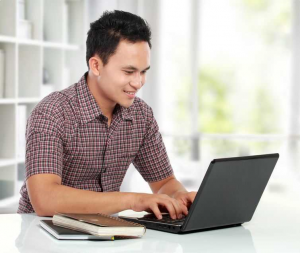 graphic of prospective student in front of a laptop 