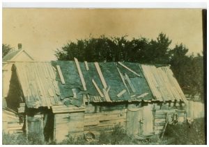 B&W photo of dilapidated building.