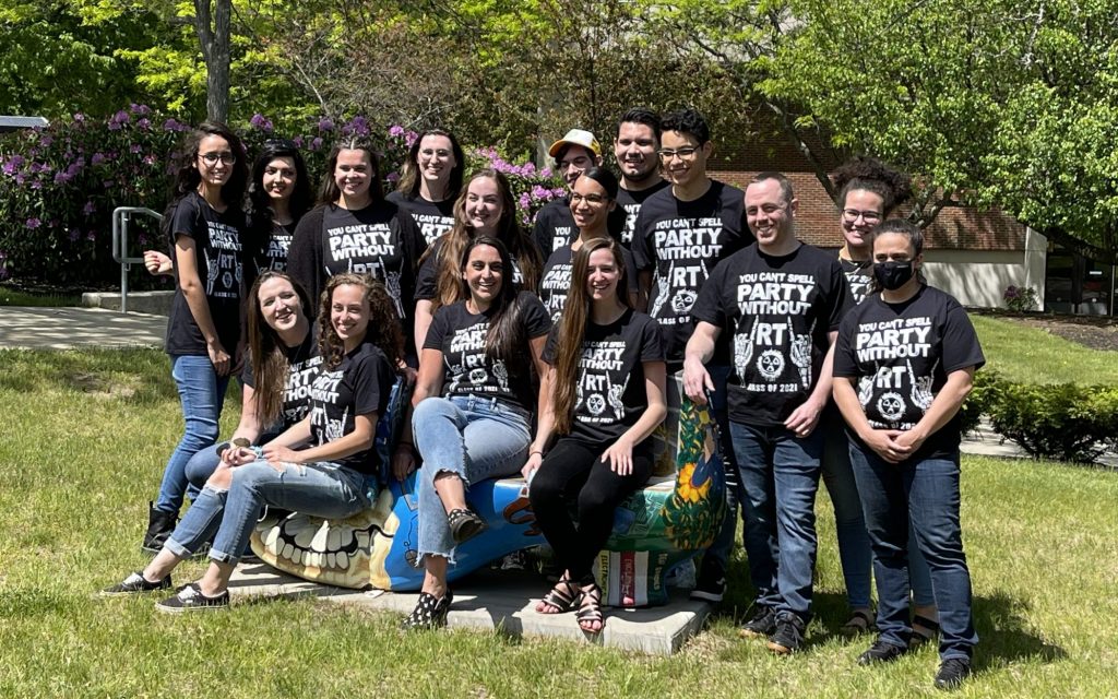 Group of 16 Rad tech graduates pose in matching t-shirts on the haverhill campus