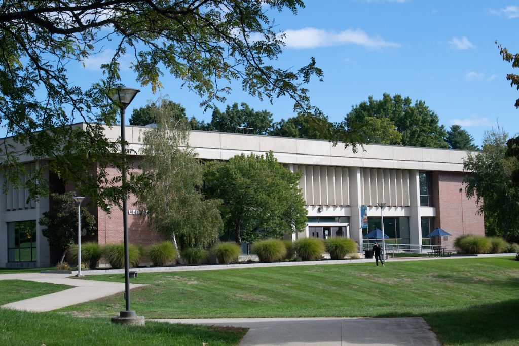 library on the havehill campus with full, green trees and freshly cut lawn