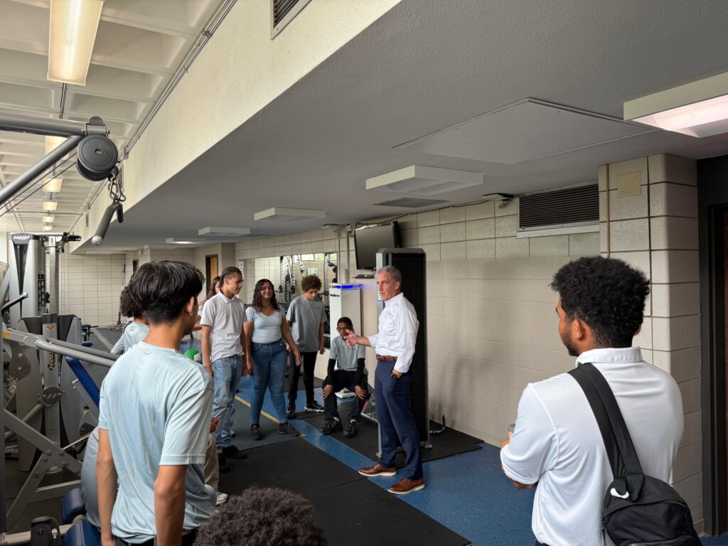 president glenn addresses group of students