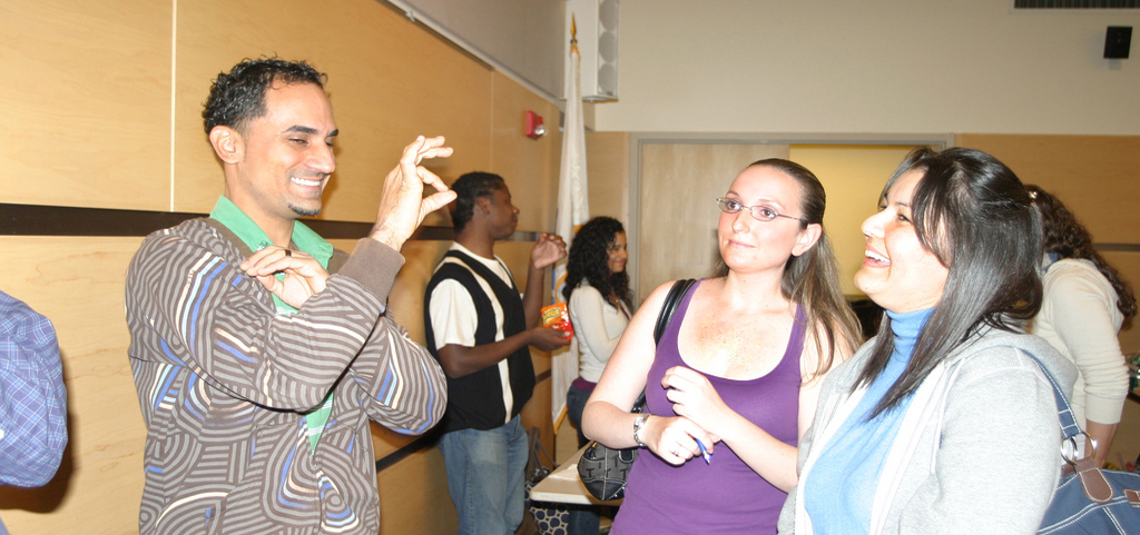 Members of the ASL chatting with students