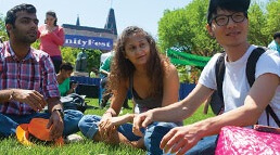 International students sitting on the grass at Gallaudet's Unity Fest.