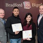 employees displaying earned certificates