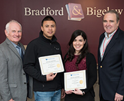 employees displaying earned certificates