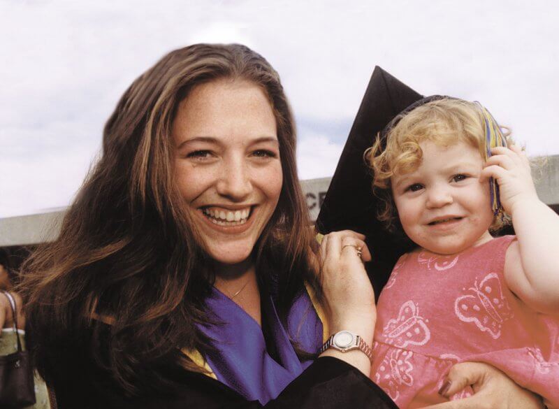 Graduate with child.