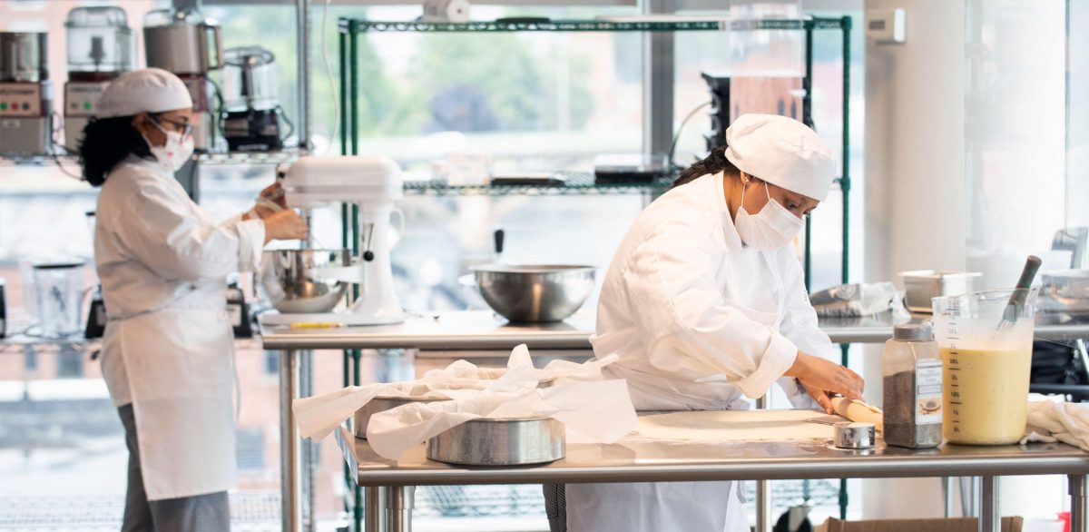 Students of Culinary Arts preparing a dish