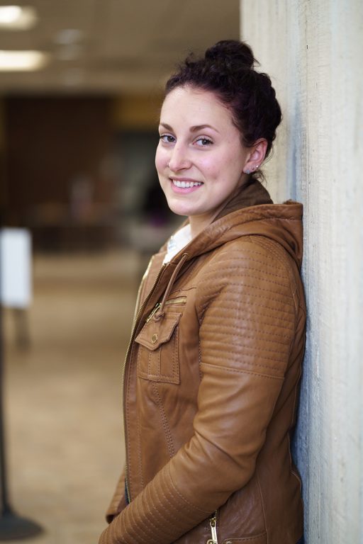 Elizabeth Giroux, leaning against the wall outside.