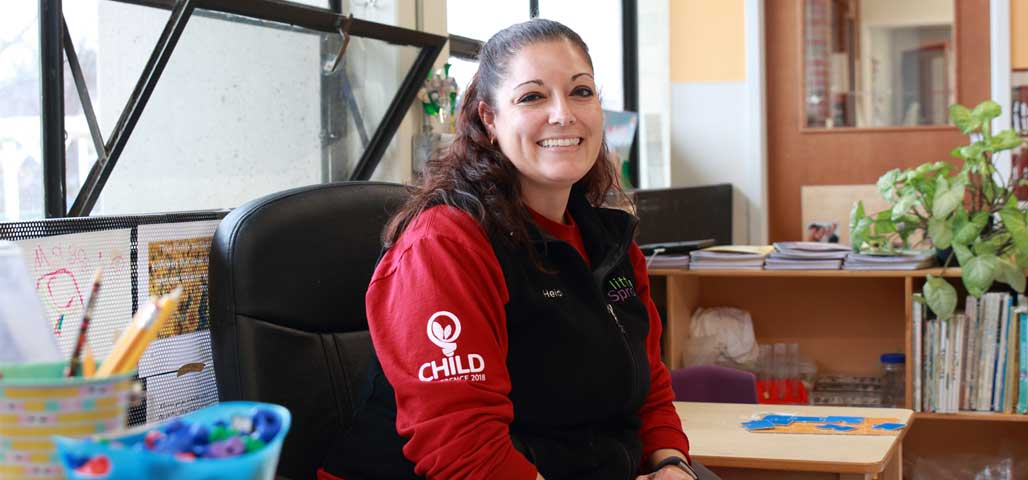 An Early Childhood Director sitting at her desk.