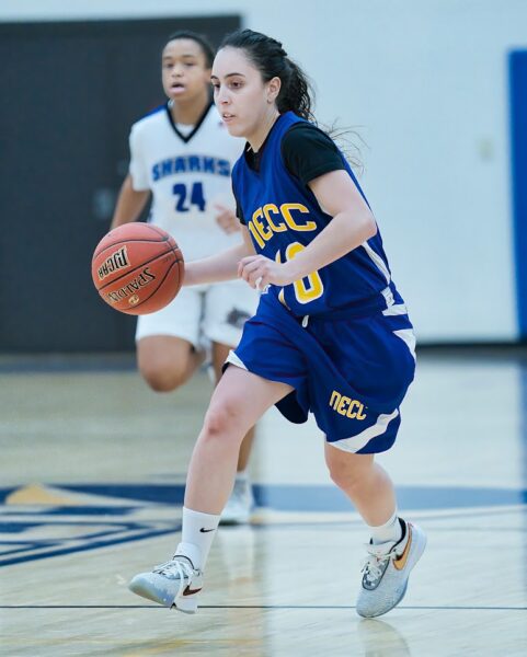 An NECC basketball player dribbling the ball