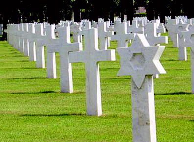 A grave yard with what seems like an amount too-many-to-count of crosses (grave markers) in rows.