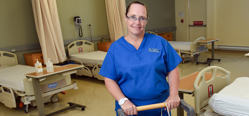 A Health Specialization associate degree student in a hospital emergency room simulation room