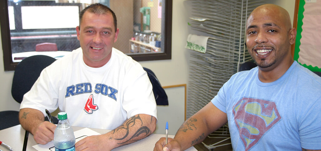 A Direct Support Certificate student sitting side-by-side with another individual in a friendly manner.