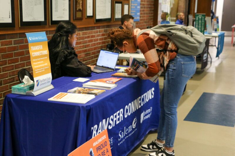 A student engaging at a transfer fair
